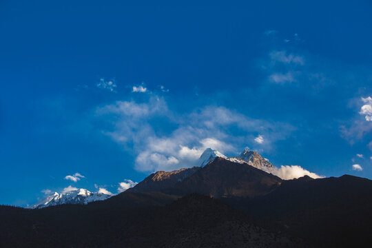 Himalayan mountains on blue sky. Nepal