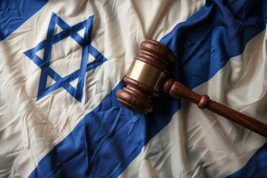 A judges gavel hammer with an Israel flag. law and order