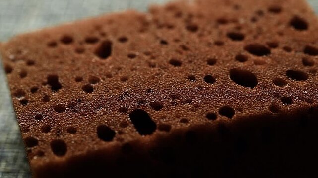 brown sponge close-up. item for cleaning and washing