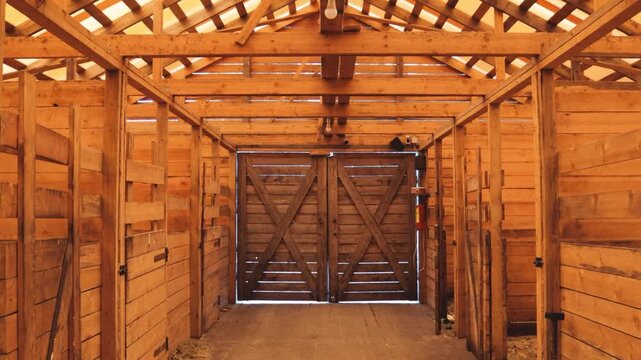 A rustic barn with wooden walls and a door