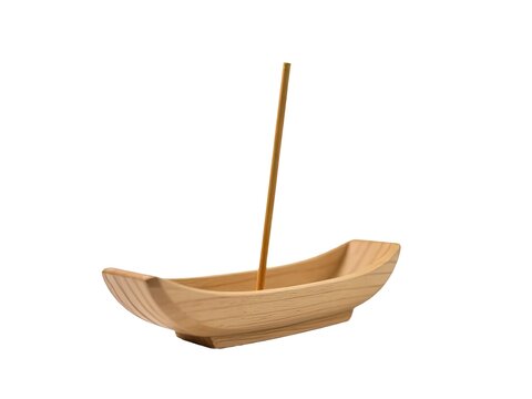 A small wooden boat found with a stick inserted into it
