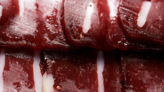 Savory basturma slices arranged in an artistic display for food lovers