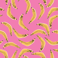 Fototapeta premium A seamless vector pattern of hand-drawn bananas in mustard yellow with black speckles on vibrant pink background