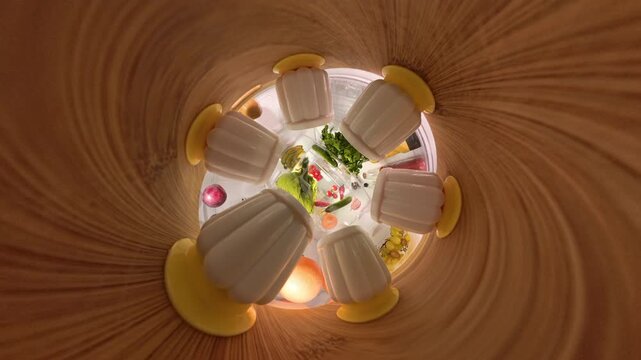 "Tiny Planet" effect inside a refrigerator with a 360-degree rotating view, creating a circular, tunnel-like perspective of food items and containers on a wooden shelf. The immersive effect gives a wh