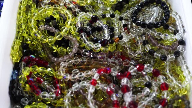 Colorful transparent glass bead bracelets arranged in decorative composition