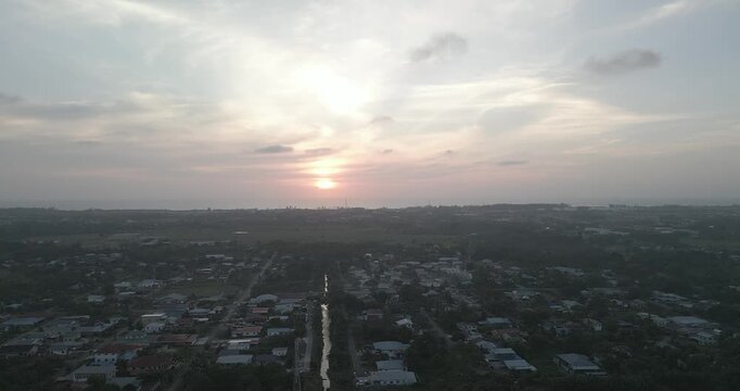 Beautiful Sunset Aerial Drone View At Miri Pujut Sarawak,Golden Hours During Evening Summer With View Of River And Green Tress