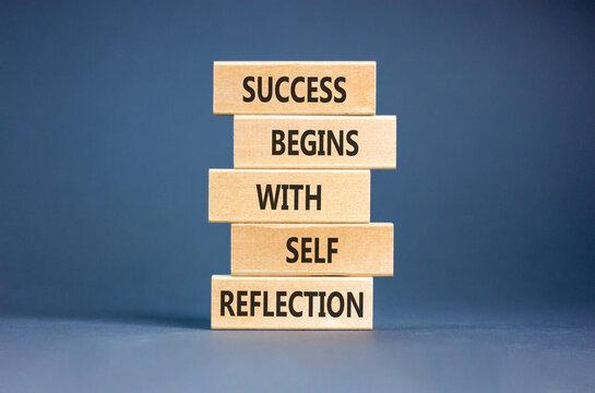 Self reflection symbol. Concept words Success begins with self reflection on beautiful wooden blocks. Beautiful grey paper background. Business success begins with self reflection concept. Copy space