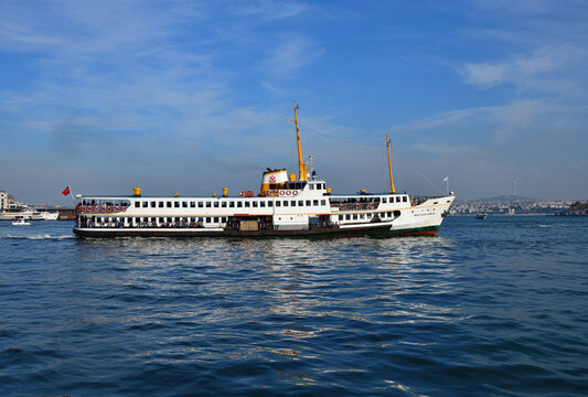 Istanbul, Turkey - Dec 10, 2023: Sehit Ilker Karter ferry in Bosphorus Strait. Ferry is one of oldest  transportation in Istanbul as city is  separated by the Bosphorus strait and surrounded by sea