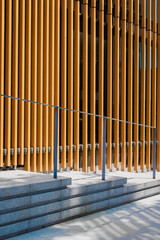 Obraz premium Vertical metal slats with diagonal handrail on steps