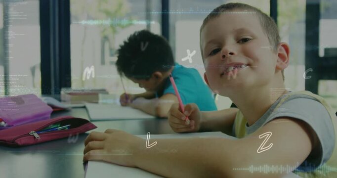 Foreground boy pausing then smiling at camera in classroom reacting to overlaid letters and waves