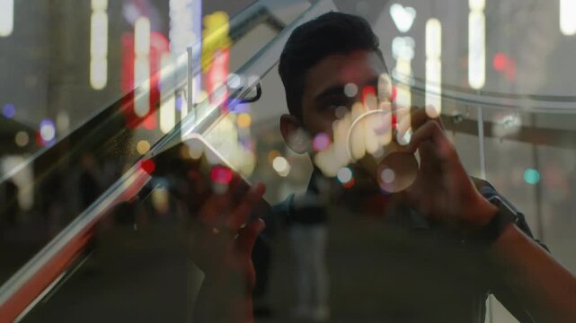 Business man glancing at phone, sipping coffee while checking messages, bokeh drifting across frame