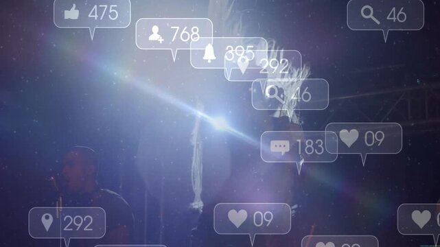 Lead singer moving into backlight onstage, getting reactions as icons rising and counters settling