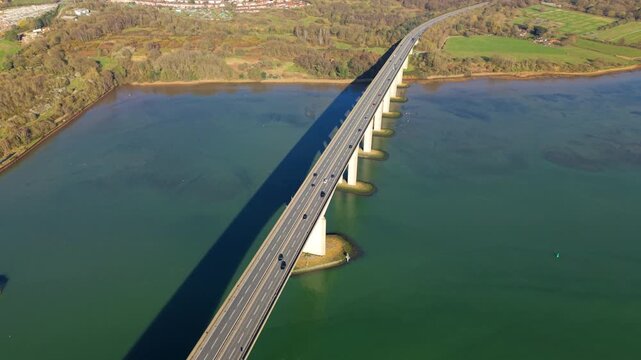 Aerial drone view of Orwell Bridge with traffic crossing over the River Orwell near Ipswich, UK