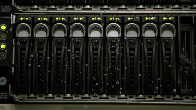 Server drive bay showing caddies with handles, LEDs while airflow drifting dust down for monitoring