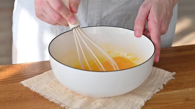 Whisking dough in bowl, baking process and homemade cooking concept