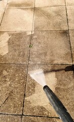  Cleaning tiles with a high-pressure water jet