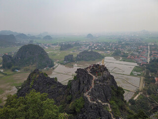 Fototapeta premium Pagoda at Hang Mua Peak Overlooking Karst Landscape in Vietnam