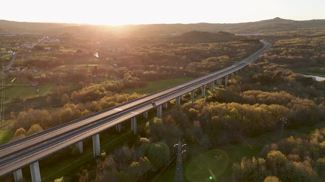 Highway viaduct with car traffic at sunset