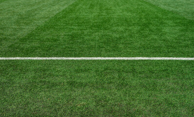 Obraz premium Green Grass Soccer Field with White Line, Sports Background Texture