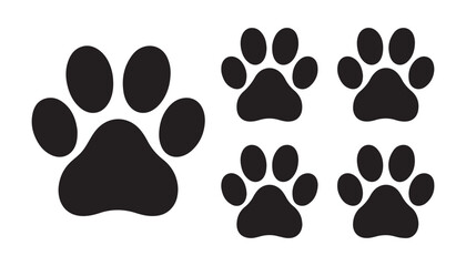 Large and small dog paw prints in black solid silhouette style, isolated on white background. © Sumon