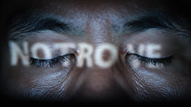 Extreme Close Up of Man Eyes Focused on Digital Data Screen