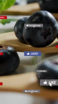 Vertical video: Cursor clicking LIKE badges popping over blueberries clearing back to berry for ads