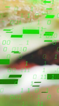 Vertical video: Camera shifting up focusing burger sharpening as green code overlaying for foodtech