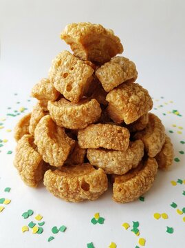 Stack of Crispy Torresmo Isolated on White Background Minimal Style