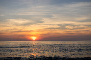 Obraz premium Colorful sunset over calm sea horizon, natural background Lithuania