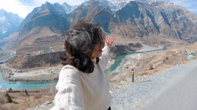 4K selfie shot of Indian woman vlogging while travel in mountains at Lahaul, Himachal Pradesh, India. Influencer woman talking on live stream at social network platform for subscribers, followers.  Fe
