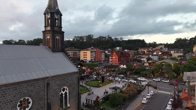 Aerial view of S&atilde;o Pedro Chucrch and houses with European Alpine architecture on Borges de Medeiros Avenue - Gramado, Rio Grande do Sul, Brazil