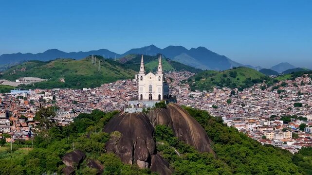 Aerial View of Basilica Sanctuary of Our Lady of Penha Built on a Rock With Views of the Neighborhood Behind in Rio de Janeiro City