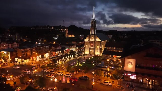 Aerial view of S&atilde;o Pedro Chucrch and houses with European Alpine architecture on Borges de Medeiros Avenue - Gramado, Rio Grande do Sul, Brazil