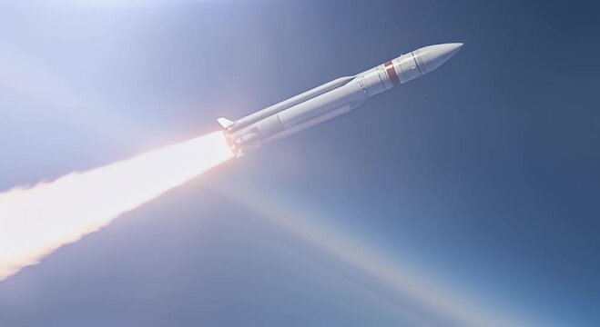 Rocket launch ascending into atmosphere against blue sky