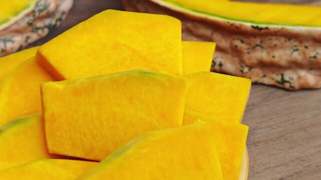 The pumpkin is sliced ​​on a cutting board,Fresh pumpkin 