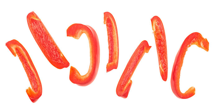 Cut slices of red sweet bell pepper isolated on a white background, top view. Fresh Bulgarian pepper.