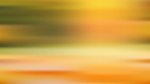 A smooth and blurry background texture displaying a vibrant blend of warm golden yellow and soft orange color light gradients.