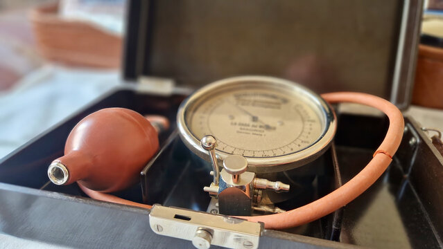 Antique aneroid sphygmomanometer measuring blood pressure in case