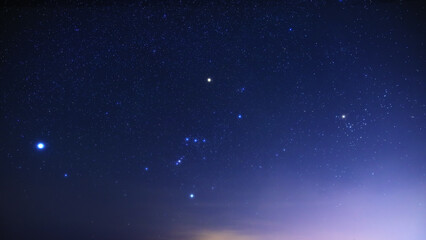 Fototapeta premium Orion constellation and Milky Way stars on a dark countryside skies.