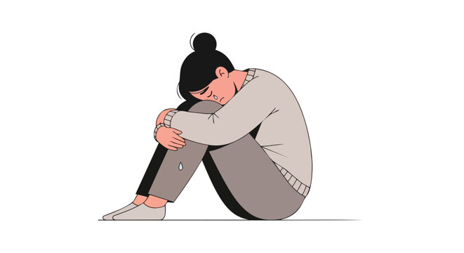 Sad young woman sitting alone hugging knees in depression