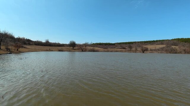 Static Pan of Mountain Lake from Shore. Vrmdza, Mount Rtanj area. Balkans, Serbia.