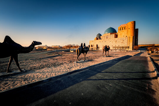 Stunning sunset view of the incomplete Mausoleum of Khoja Ahmed Yasawi in Turkistan, Kazakhstan, an unique masterpiece in Timurid architecture