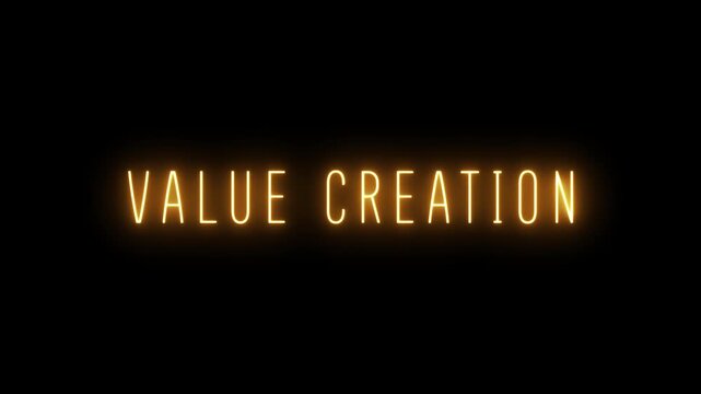 Bright orange neon text spelling out VALUECREATION glows intensely against a deep black background creating a vibrant and impactful visual statement for business and finance concepts