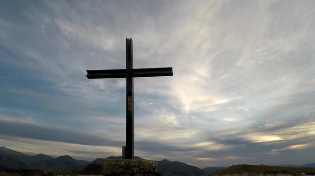 cross on top of a mountain, time lapse clouds running