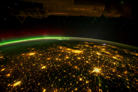 Planet Earth Night View With Aurora Borealis And City Lights Over USA. Satellite view of Midwestern USA city lights at night. Elements of this image furnished by NASA.