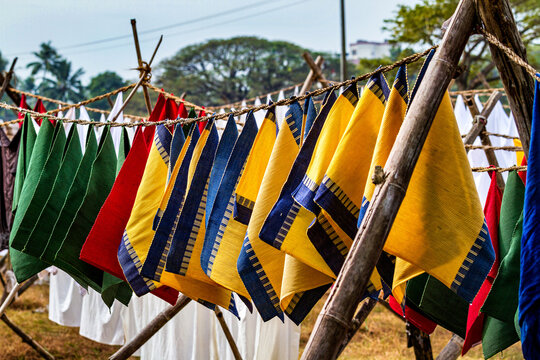 Dhobi Ghat, open air laundry in Kochi, India, cleaned clothes hanging on clothes line to dry, washing bed sheets and linen