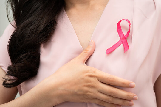 Asian woman with pink ribbon, World Breast Cancer Day at October.