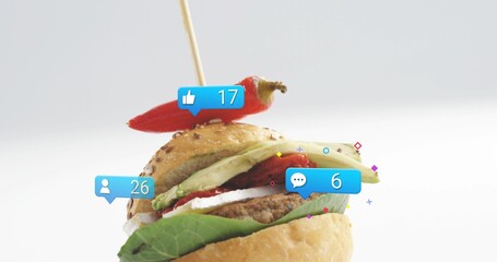 Showcasing gourmet slider sandwich sitting on white backdrop with skewered chili and social icons © vectorfusionart