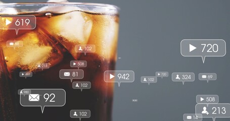Obraz premium Showing cola glass, ice, condensation, rim glow in studio, alerts with icons and counts, copy space