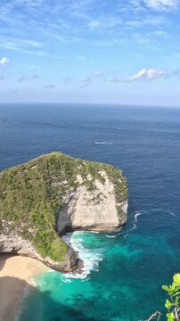 vertical video of Kelingking beach t rex head cliff in nusa penida bali indonesia